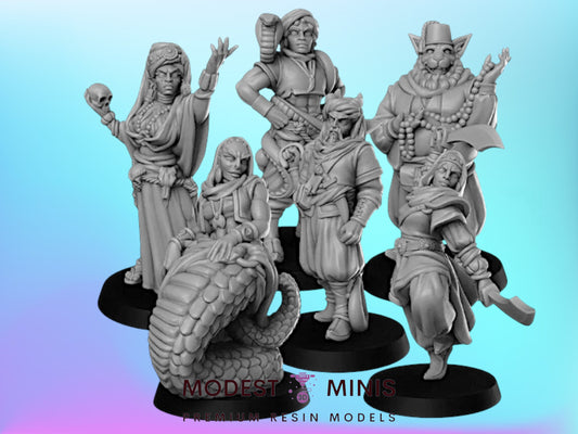 five figurines of fantasy characters, including a woman, a man, a cat, a dragon, and a snake, all posed together.