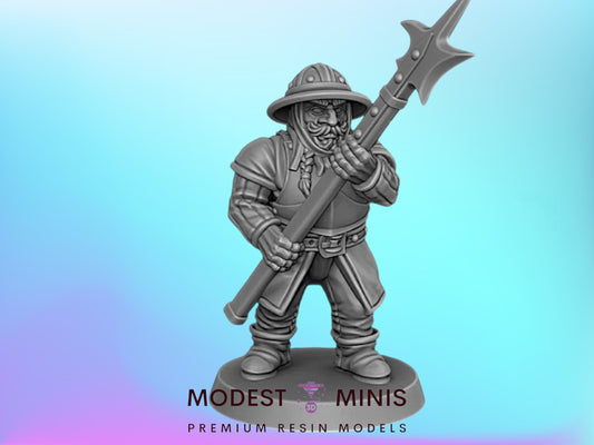 A figurine of a medieval knight holding a spear and shield, standing against a blue background.