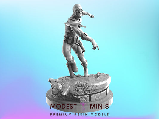 A 3D model of a superhero character standing on a pedestal, with the text "MODEST MINIS PREMIUM RESIN MODELS" below the figure.