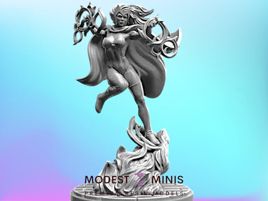 A statue of a female character with flowing hair and a cape, standing on a pedestal and holding a weapon.