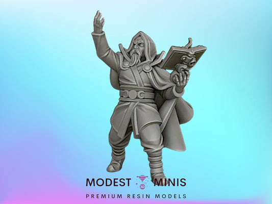 A statue of a wizard or magical figure holding a book and standing with one hand raised.