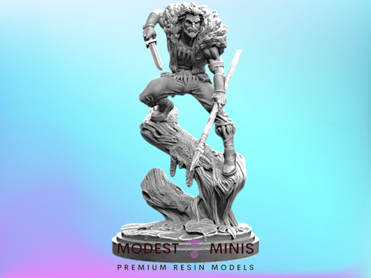 A statue of a warrior figure, holding a sword and shield, standing on a rock formation against a blue background.