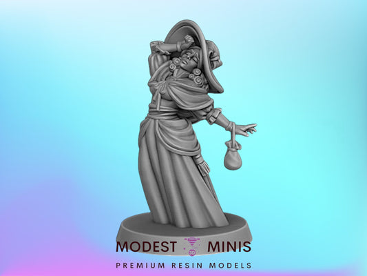 A statue of a woman wearing a hat and holding a bag, standing on a pedestal with the text "MODEST MINIS PREMIUM RESIN MODELS" below it.