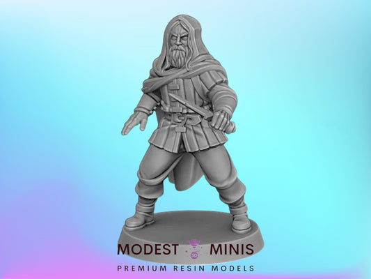 A statue of a bearded man in a long robe, holding a sword, against a blue background.